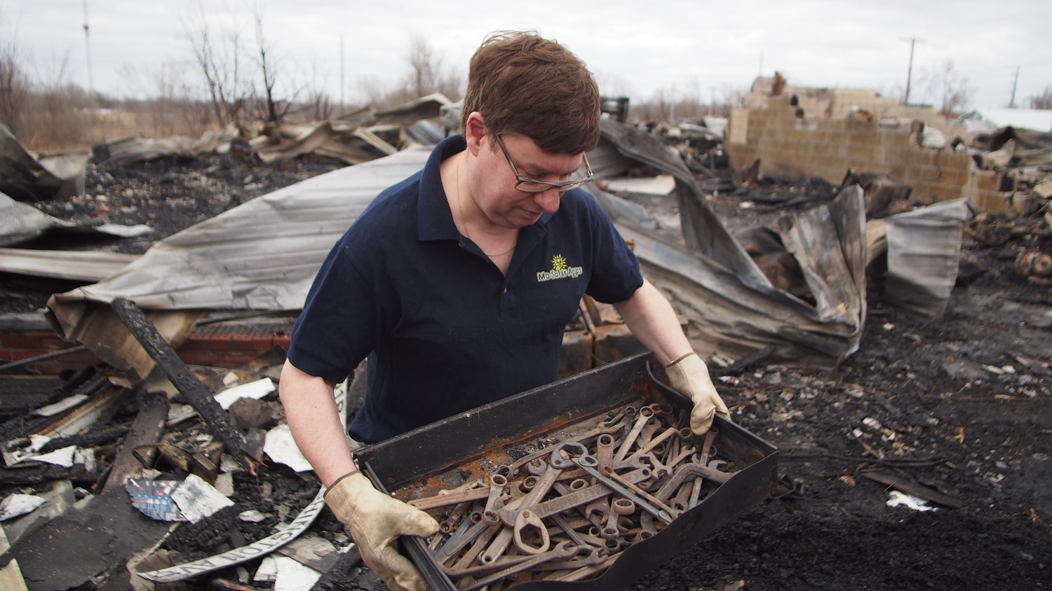 Curt Holman finds a drawer of tools Wednesday, March 10, 2021, from the fire that destroyed Martinez Body Shop, 101 W. Washington Ave., on Tuesday, March 9, 2021. Not much else survived the searing heat.